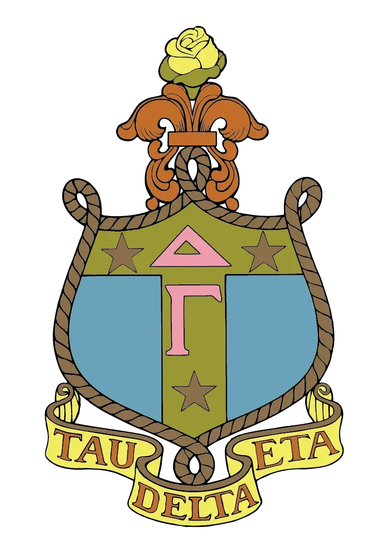 Delta Gamma sorority crest featuring a blue, olive, and pink shield with the Greek letters "Δ" and "Γ" and three stars, topped by a yellow rose and fleur-de-lis, bordered by rope detailing, with a yellow banner reading "Tau Delta Eta."