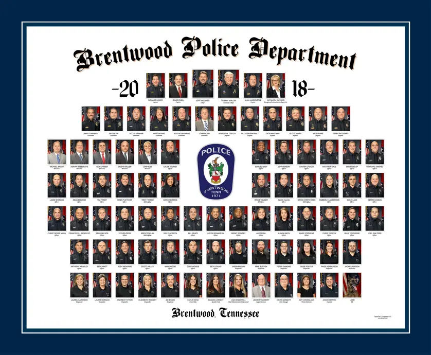 Police department composite on white with a patch in the middle and navy blue matting around the outside. 
