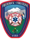 Frederick-Firestone Fire Department official badge featuring a shield shape with a Maltese cross, EMS Star of Life, American and Colorado state flags, a mountain landscape, an oil derrick, and text reading "Frederick-Firestone Fire."