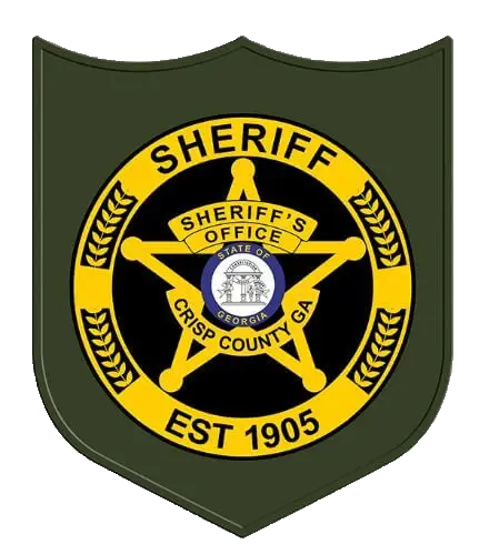 Crisp County Sheriff's Office official badge featuring a green shield shape with a black and gold circular emblem, a gold five-pointed star, the Georgia state seal, and text reading "Sheriff, Crisp County GA, Est 1905."