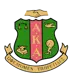 Alpha Kappa Alpha sorority crest featuring a green and pink shield with the letters "A.K.A.," scales of justice, a dove, an oil lamp with books, and a running figure, topped by clasped hands, with a gold banner reading